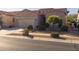 Single-story home with a two-car garage and neatly landscaped yard at 2653 E Marcos Dr, Casa Grande, AZ 85194