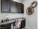 Built-in home office with granite countertop and dark brown cabinets at 2653 E Marcos Dr, Casa Grande, AZ 85194