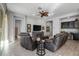 Relaxing living room with hardwood floors, comfortable seating and a large TV at 2653 E Marcos Dr, Casa Grande, AZ 85194