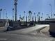 Entrance to Mesa Village mobile home community, featuring palm trees and signage at 2701 E Allred Ave # 110, Mesa, AZ 85204