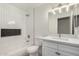 Clean bathroom with white subway tile and bathtub at 2716 N 88Th Ln, Phoenix, AZ 85037