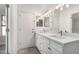 Bright bathroom with double vanity and updated fixtures at 2716 N 88Th Ln, Phoenix, AZ 85037