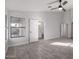 Primary bedroom with ensuite bathroom and grey tile flooring at 2716 N 88Th Ln, Phoenix, AZ 85037