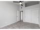 Bedroom with double door closet and wood-look floors at 2716 N 88Th Ln, Phoenix, AZ 85037