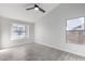 Well-lit bedroom with two windows and ceiling fan at 2716 N 88Th Ln, Phoenix, AZ 85037