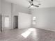 Bright bedroom with large closet and grey tile flooring at 2716 N 88Th Ln, Phoenix, AZ 85037