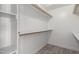 Spacious closet with built-in shelving and hanging rods at 2716 N 88Th Ln, Phoenix, AZ 85037