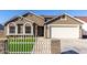 Newly built home with a two-car garage and artificial turf at 2716 N 88Th Ln, Phoenix, AZ 85037