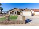 Newly built home with a two-car garage and artificial turf at 2716 N 88Th Ln, Phoenix, AZ 85037