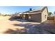 Back of house showing patio, yard, and solar panels at 2716 N 88Th Ln, Phoenix, AZ 85037