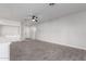 Open living area with tile flooring and neutral color palette at 2716 N 88Th Ln, Phoenix, AZ 85037