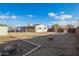 House backyard with a concrete pathway and raised garden bed at 2870 W Manzanita St, Apache Junction, AZ 85120