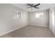 Well-lit bedroom with carpet and ceiling fan at 2870 W Manzanita St, Apache Junction, AZ 85120