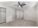 Bedroom with mirrored closet doors and ceiling fan at 2870 W Manzanita St, Apache Junction, AZ 85120