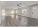 Bright living room with laminate flooring and ceiling fan at 2870 W Manzanita St, Apache Junction, AZ 85120