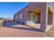 Covered patio with sliding glass doors and stucco exterior at 3015 W Paraiso Dr, Eloy, AZ 85131