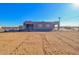 House exterior with a fenced yard and desert landscape at 3015 W Paraiso Dr, Eloy, AZ 85131