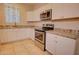 Modern kitchen with white cabinets and stainless steel appliances at 3015 W Paraiso Dr, Eloy, AZ 85131