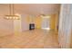 Bright living room with tile flooring, fireplace, and access to kitchen at 3015 W Paraiso Dr, Eloy, AZ 85131