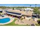 Aerial view of the backyard oasis, complete with a sparkling pool and solar panels at 3357 E Gold Dust Ave, Phoenix, AZ 85028