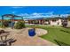 Expansive backyard with putting green, pool and pergola at 3357 E Gold Dust Ave, Phoenix, AZ 85028