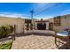 Outdoor patio with fireplace, seating, and wood storage at 3357 E Gold Dust Ave, Phoenix, AZ 85028