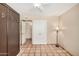 Spacious bedroom with tile floors, double doors and large closet at 3357 E Gold Dust Ave, Phoenix, AZ 85028