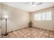 Bright bedroom featuring tile flooring and a ceiling fan at 3357 E Gold Dust Ave, Phoenix, AZ 85028