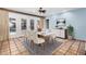 Bright dining room with a table and chairs near sliding doors to a patio at 3357 E Gold Dust Ave, Phoenix, AZ 85028