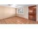 Bright entryway with tile flooring, a wood door and a window with shutters at 3357 E Gold Dust Ave, Phoenix, AZ 85028