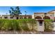 House exterior featuring a lush green hedge and a charming front entrance at 3357 E Gold Dust Ave, Phoenix, AZ 85028