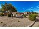 Landscaped yard with gravel, desert plants, and a charming home exterior at 3357 E Gold Dust Ave, Phoenix, AZ 85028