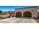 Two-car garage with wood garage doors and ample parking space at 3357 E Gold Dust Ave, Phoenix, AZ 85028