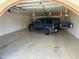 Spacious garage interior with overhead lighting, providing parking for an SUV at 3357 E Gold Dust Ave, Phoenix, AZ 85028