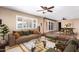 Gathering room with hardwood floors, a sofa and a view into the dining area at 3357 E Gold Dust Ave, Phoenix, AZ 85028