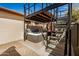 Hot tub with elevated platform and metal stairs at 3357 E Gold Dust Ave, Phoenix, AZ 85028