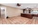 Open concept kitchen with island, stainless steel appliances, and tile floors at 3357 E Gold Dust Ave, Phoenix, AZ 85028