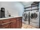 Updated laundry room with cabinets and quartz countertop at 3357 E Gold Dust Ave, Phoenix, AZ 85028