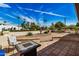 Relaxing outdoor patio space with a fire pit and comfortable seating at 3357 E Gold Dust Ave, Phoenix, AZ 85028