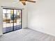 Bedroom with balcony access and carpet flooring at 3427 E Lance Ln, Phoenix, AZ 85018