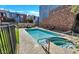 Community pool and spa with lounge chairs at 3427 E Lance Ln, Phoenix, AZ 85018