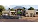 Stunning contemporary home with mountain views and desert landscaping at 3529 S Kings Ranch Ct, Gold Canyon, AZ 85118