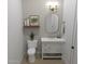 Stylish bathroom featuring a white vanity and oval mirror at 3529 S Kings Ranch Ct, Gold Canyon, AZ 85118