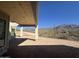 Outdoor space featuring a modern patio and a picturesque view of the surrounding desert mountains, still under construction at 3529 S Kings Ranch Ct, Gold Canyon, AZ 85118