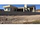 View of the rear of the new construction home, showing backyard with block wall at 3529 S Kings Ranch Ct, Gold Canyon, AZ 85118