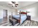 Primary bedroom with wood flooring and ceiling fan at 3548 E Mesquite St, Gilbert, AZ 85296