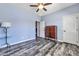 Spacious bedroom featuring wood-look floors and ample closet space at 3548 E Mesquite St, Gilbert, AZ 85296