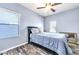 Cozy bedroom with a queen bed and ceiling fan at 3548 E Mesquite St, Gilbert, AZ 85296