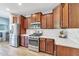 Modern kitchen with stainless steel appliances and quartz countertops at 3548 E Mesquite St, Gilbert, AZ 85296