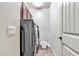 Convenient laundry room with washer, dryer, and built-in shelving at 3548 E Mesquite St, Gilbert, AZ 85296